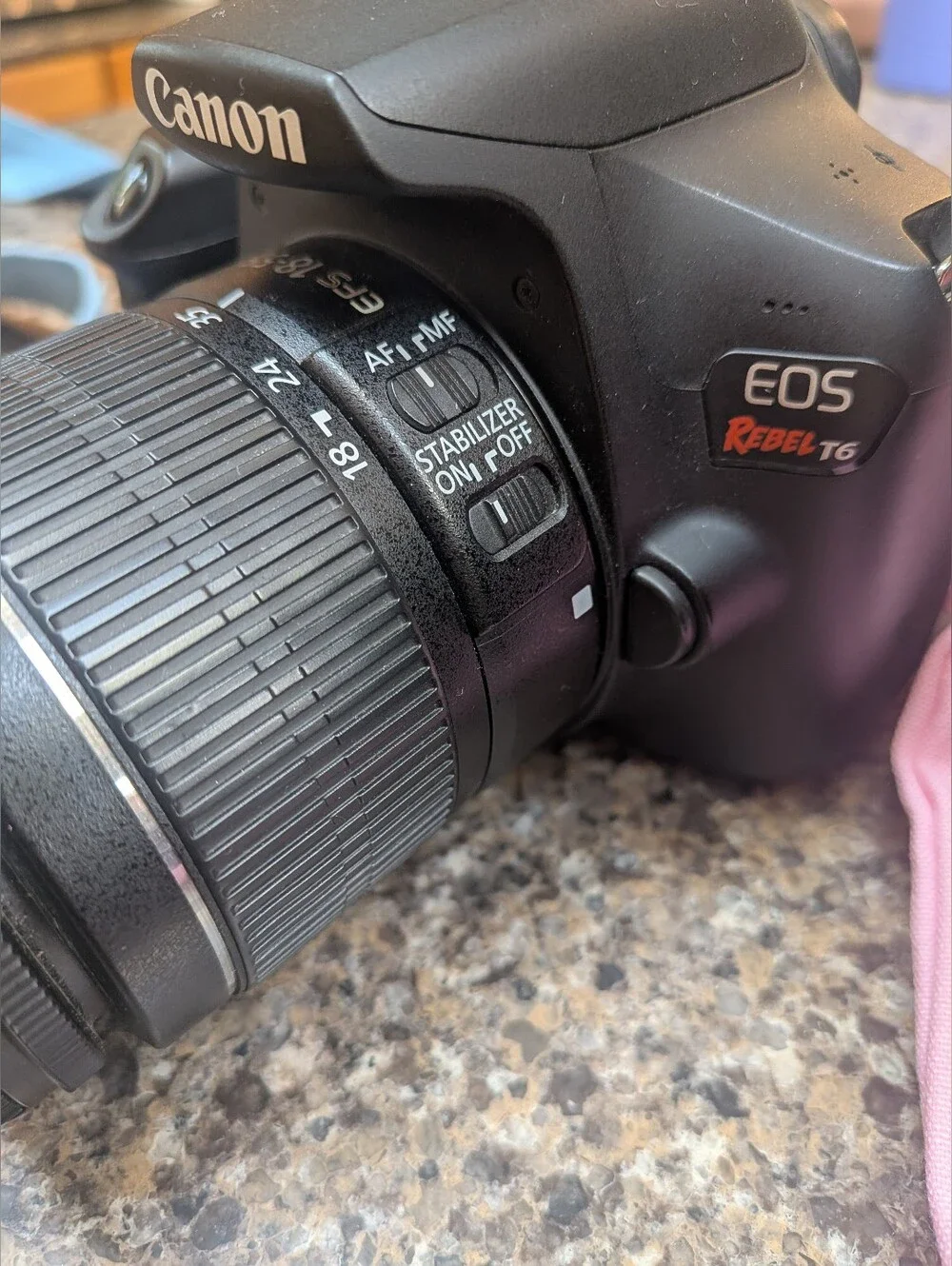 Canon DSLR Camera with Interchangeable Lenses in Black Accent